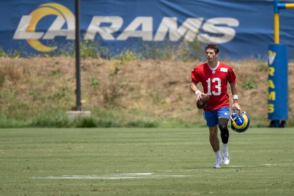 Los Angeles Rams quarterback Stetson Bennett jogs back after the NFL football team's camp, Tuesday, June 13, 2023, in Thousand Oaks, Calif. (AP Photo/Kyusung Gong)