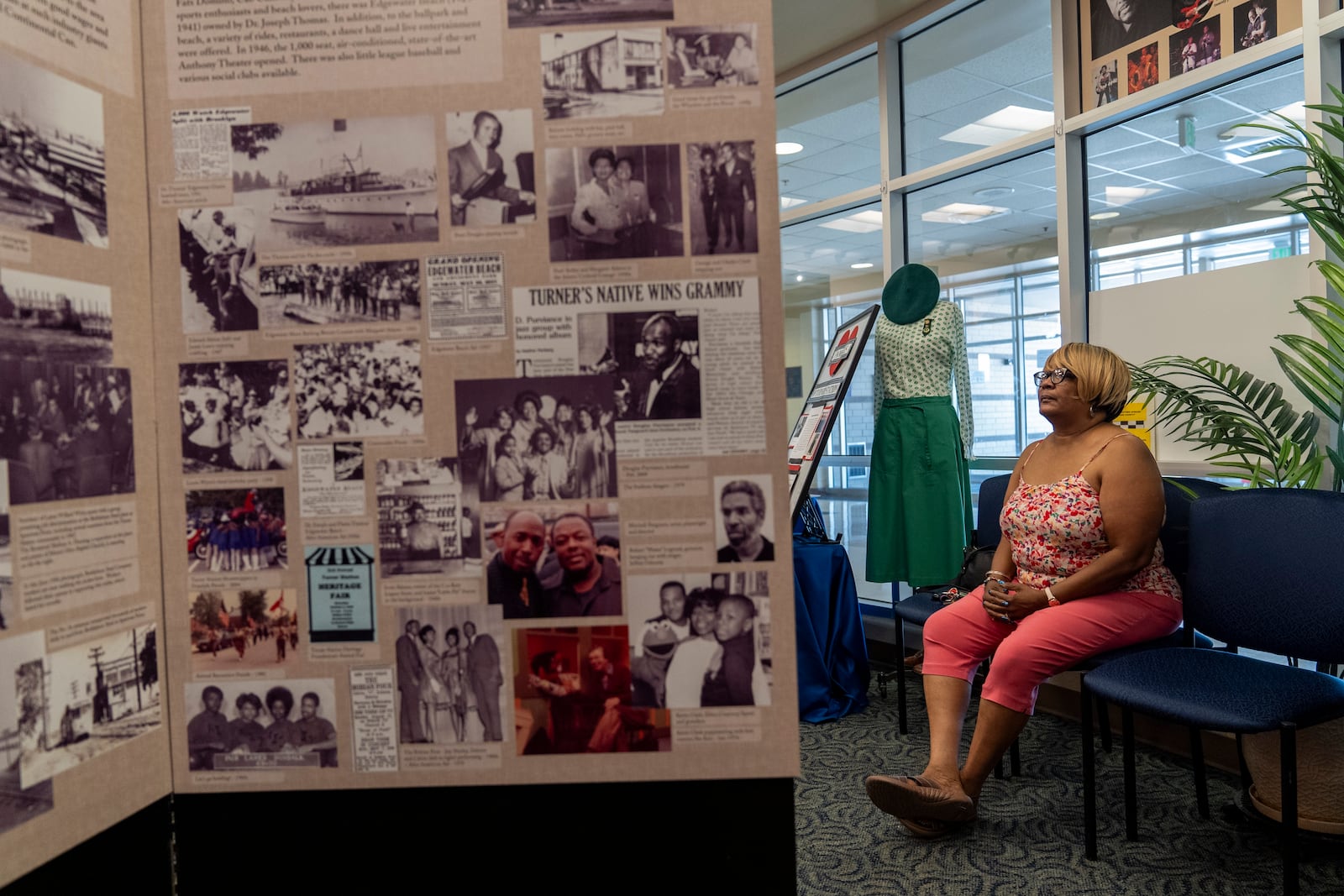 Angie Banks, a volunteer at the Turner Station History Center, is pictured among artifacts and informational posters inside the community museum, Friday, Aug. 16, 2024, in Turner Station, Md. (AP Photo/Stephanie Scarbrough)