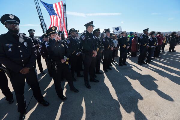 Ferguson Sgt. Jill Gronewald tears up as she join hundreds of family, friends and fellow officers as they send off injured Ferguson police officer Travis Brown to a specialized rehabilitation hospital Tuesday, Nov. 12, 2024, at Spirit of St. Louis airport in Chesterfield, Mo. (Laurie Skrivan/St. Louis Post-Dispatch via AP)