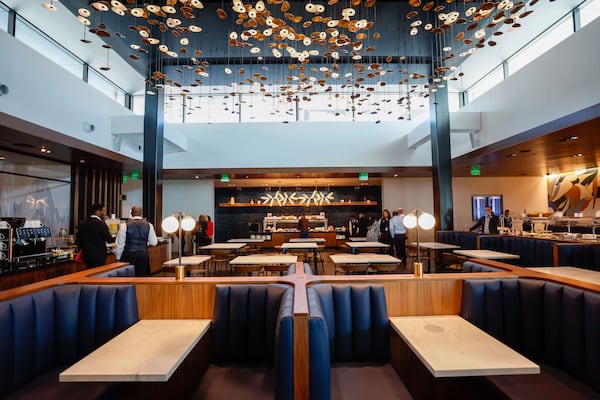 At the American Express Centurion Lounge at Hartsfield-Jackson International Airport, a large dining area has two buffets and tables for seating.
Miguel Martinez /miguel.martinezjimenez@ajc.com