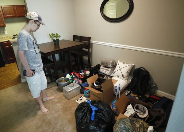 Jared Oenick, 20, checks over the items he is packing for school. Oenick, a former ward of the state, has benefited from a program that extends financial and other support to former foster children beyond the age of 18. He’s getting ready for a move to the University of North Georgia, where he hopes to earn a college degree before heading to medical school. BOB ANDRES / ROBERT.ANDRES@AJC.COM