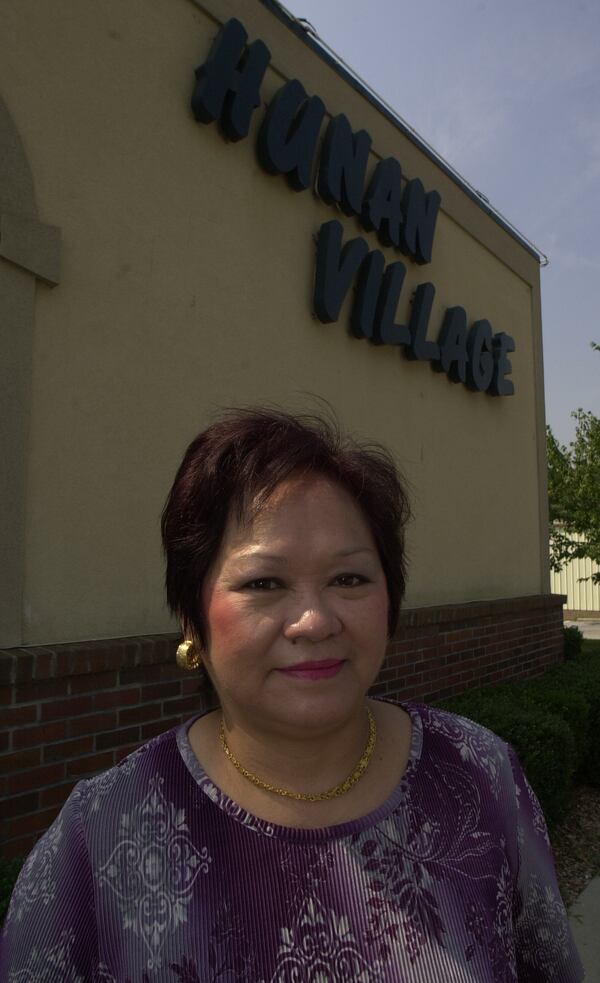 Betty Hsu in front of Hunan Village in 2000.