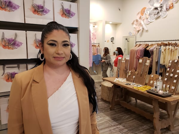 At Nadia's Boutique in Atlanta's Lenox Square mall, co-owner Nadia Lares has seen sales rebound recently. But business is still tough and another boutique she has in McDonough isn't doing as well as the holiday shopping season unfolds during a pandemic. MATT KEMPNER / AJC