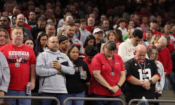 Georgia fans observe a moment of silence before the Sugar Bowl at the Caesars Superdome Thursday, Jan. 2, 2025, in New Orleans. (Jason Getz / AJC)
