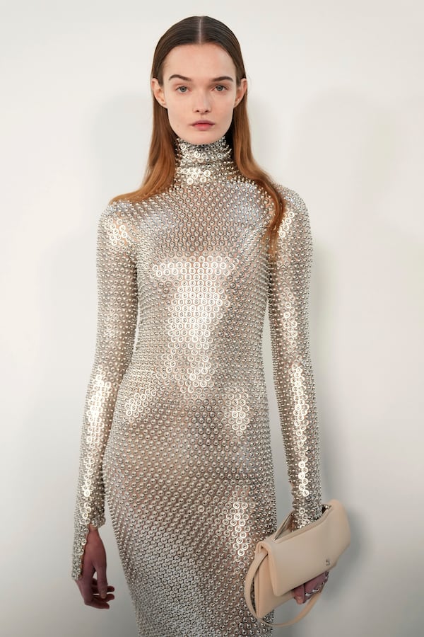 A model wears backstage a creation as part of Courreges Fall/Winter 2025-2026 Womenswear collection presented Wednesday, March 5, 2025. in Paris. (Photo by Scott A Garfitt/Invision/AP)