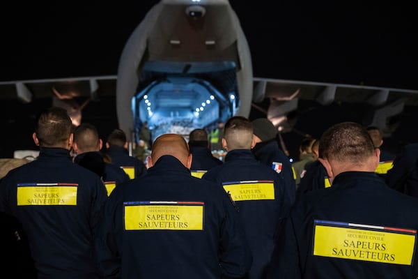 This photo provided Sunday Dec.15, 2024 by the French Army shows rescue workers before boarding a military plane for the island of Mayotte, in the Indian Ocean, after cyclone Chido caused extensive damage with reports of several fatalities, Saturday Dec.14, 2024 in Orleans, central France. (Laure-Anne Maucorps/ Etat Major des Armées via AP)