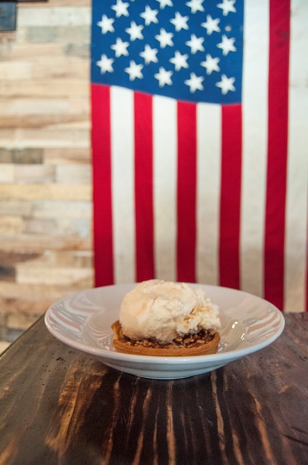 Bourbon pecan pie with vanilla ice cream, whipped cream, chocolate sauce and salted caramel at Sweet Auburn Barbecue. CONTRIBUTED BY SWEET AUBURN BARBECUE