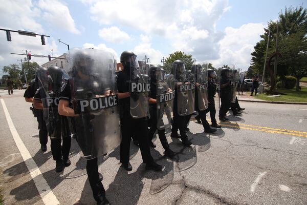 8/15/20 - Stone Mountain, GA -  Police move in to clear the area as several far-right groups, including militias and white supremacists, rally Saturday in the town of Stone Mountain, and a broad coalition of leftist anti-racist groups organized a counter-demonstration there after local authorities closed Stone Mountain park.  Steve Schaefer for the Atlanta Journal Constitution