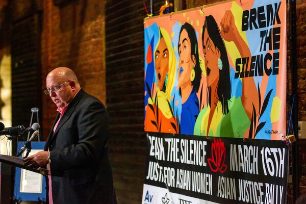 Michael Webb, ex-husband of the March 16 victim of Xiaojie Tan, talks to the crowd during the Asian Justice 1-year anniversary of the spa shootings rally in Atlanta on March 16, 2022.   STEVE SCHAEFER FOR THE ATLANTA JOURNAL-CONSTITUTION