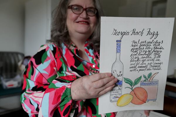 Artist Shannon Lancaster holds one of her recipe designs. Due to health issues Shannon is currently living in an extended stay hotel awaiting the approval for disability.