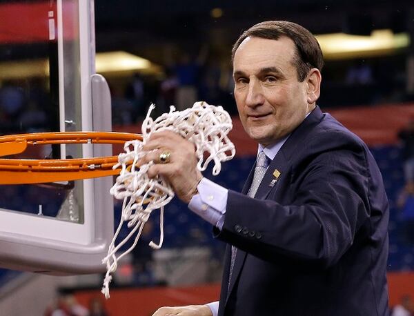 Duke head coach Mike Krzyzewski cuts down the net after his team's 68-63 victory over Wisconsin in the NCAA Final Four college basketball tournament championship game Monday, April 6, 2015, in Indianapolis. (AP Photo/David J. Phillip) Master of all he surveys. (AP Photo/David J. Phillip)