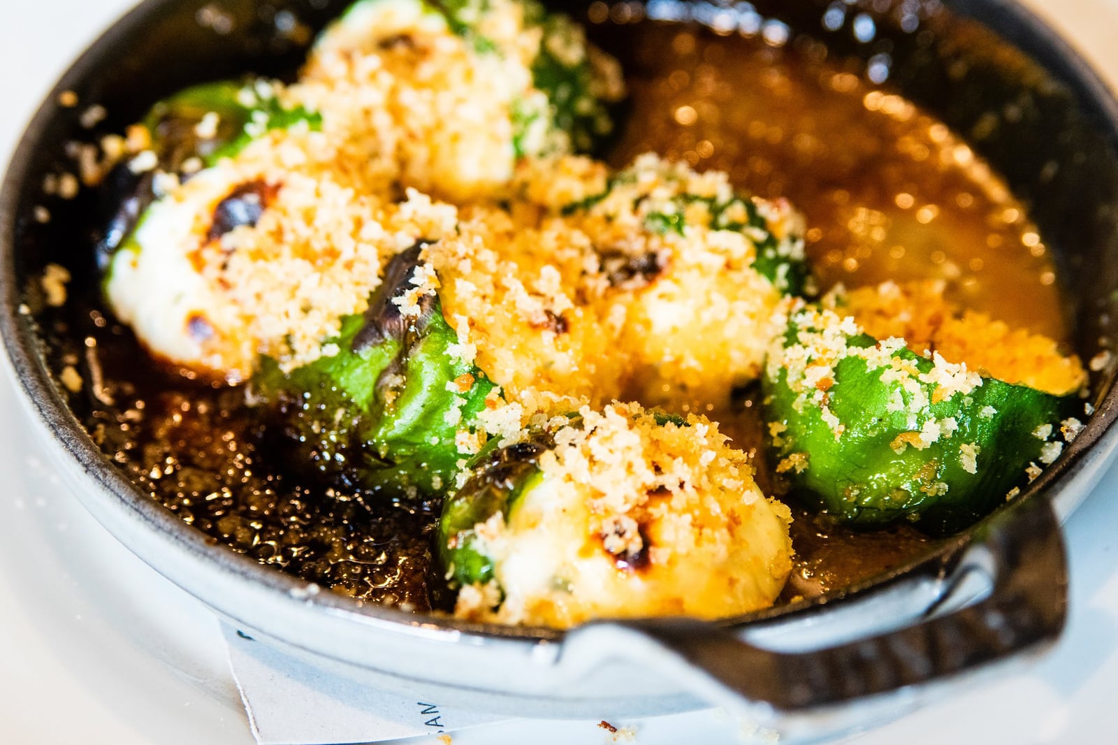 Stuffed Baby Bell Peppers with Goat Cheese & Fennel Pollen-Infused Honey at Brezza Cucina in Ponce City Market. CONTRIBUTED BY HENRI HOLLIS