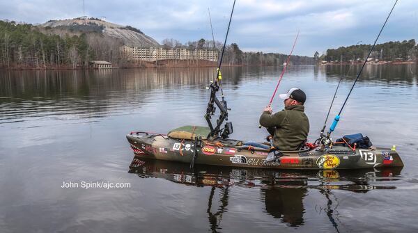 Josh Burg enjoys mild weather kayaking on  Stone Mountain Lake on Tuesday. JOHN SPINK / JSPINK@AJC.COM