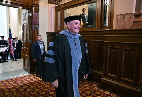 University System of Georgia Chancellor and former Georgia Gov. Sonny Perdue enters the Georgia House of Representatives chamber at the Georgia State Capitol for his investiture ceremony in 2022. (Hyosub Shin / AJC file photo)