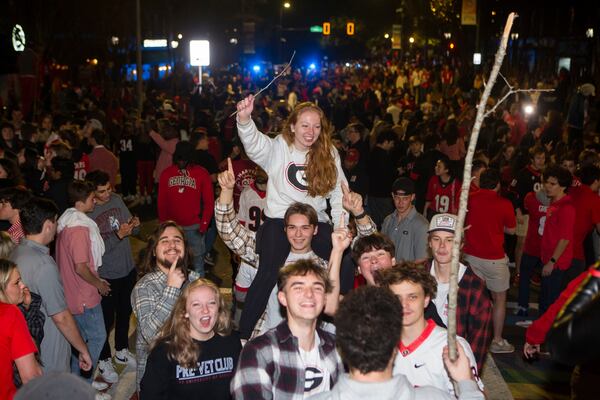 University of Georgia students and fans flood the streets to celebrate a Bulldog victory in the College Football Championship on Monday, January 9, 2023, in downtown Athens, Georgia. The University of Georgia defeated the Texas Christian University football team 65-7. CHRISTINA MATACOTTA FOR THE ATLANTA JOURNAL-CONSTITUTION.