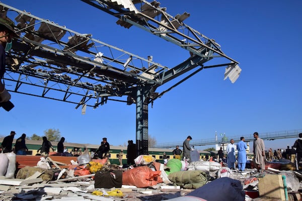 Security officials examine the site of a bomb explosion at railway station in Quetta, southwestern Pakistan, Saturday, Nov. 9, 2024. (AP Photo/Arshad Butt)