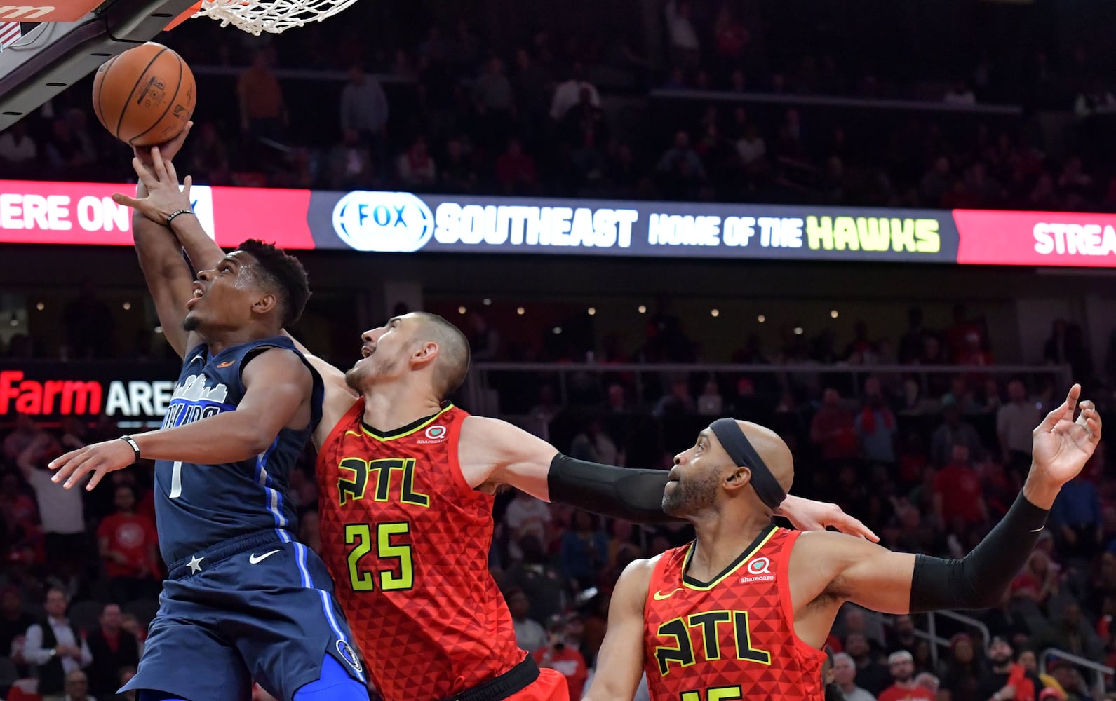 Photos: Hawks rally to beat Mavs in home opener