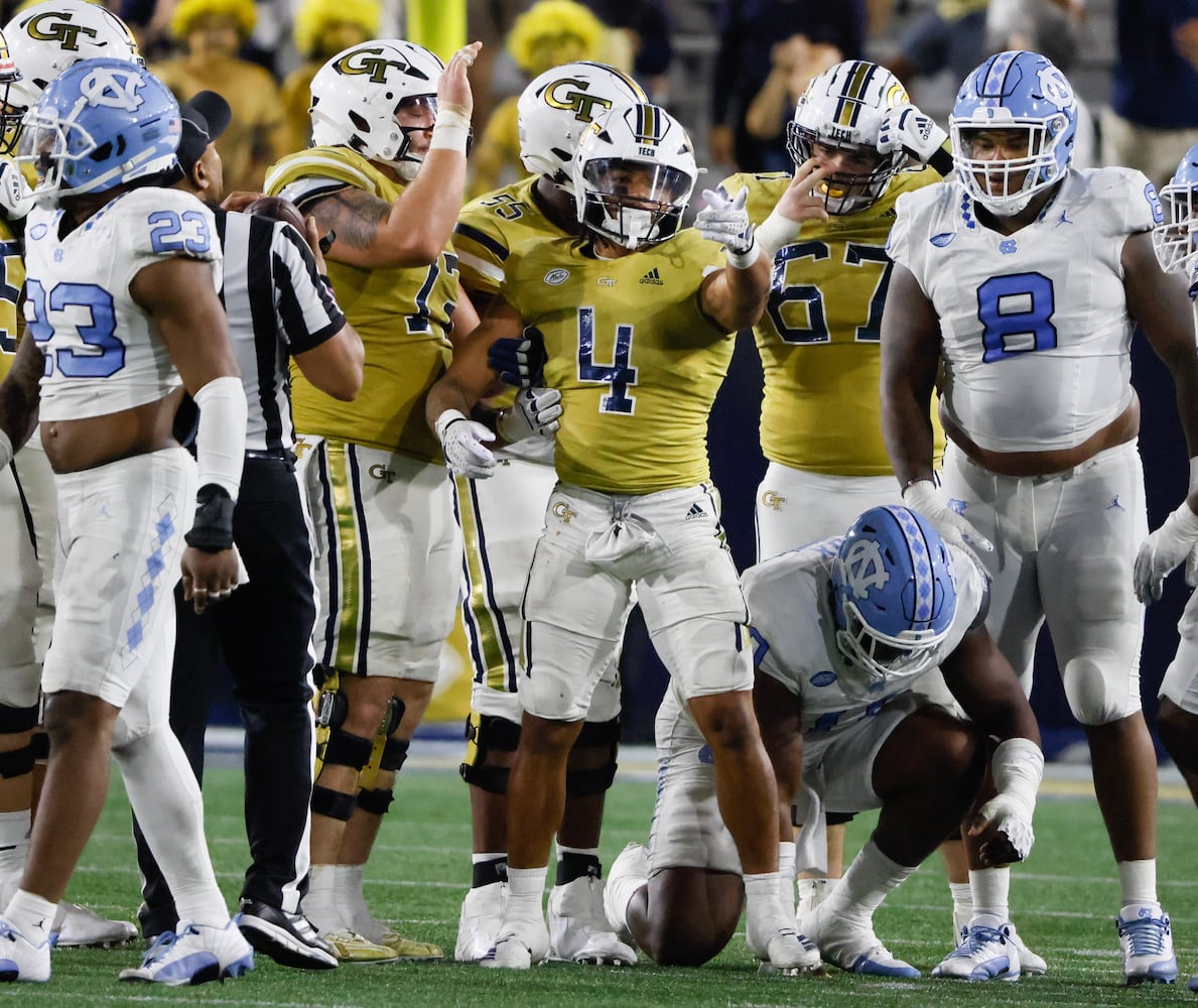 Georgia Tech Yellow Jackets running back Dontae Smith (4) indicates a Tech first down with 2:23 to go in the fourth quarter.  (Bob Andres for the Atlanta Journal Constitution)