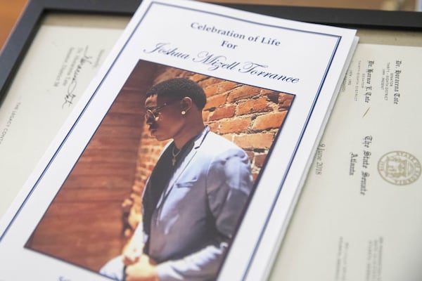 Joshua Torrance’s funeral programs rests on a pile of letters  of condolences. Torrance, was killed in May 2018, a few days after he graduated from Atlanta Public School's B.E.S.T. Academy. At his funeral, letters were read by Gov. Nathan Deal, Lt. Gov. Casey Cagle and Rep. Sheila Jones, who knew Torrance from the two years he served as a Georgia legislative page.    Georgia State Sen. Horacena Tate attended the funeral and Albany State University President  Marion Fedrick spoke. Torrance was scheduled to attend ASU in the fall.