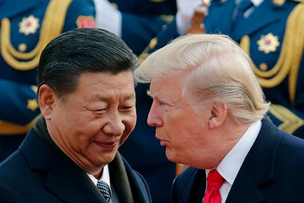 U.S. President Donald Trump, right, chats with Chinese President Xi Jinping during a welcome ceremony at the Great Hall of the People in Beijing. For much of the last four decades, the U.S. approach had been mostly to engage and try to cooperate with Beijing. But in the last few years, Xi has tightened the Communist Party grip on Chinese society, which has caused difficulties in relations.