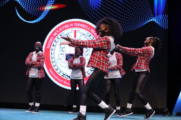 Dancers from Therrell High School perform an acrobatic and energetic act at the start of the Atlanta Public Schools' State of the District address on Nov. 18, 2021. Miguel Martinez for The Atlanta Journal-Constitution