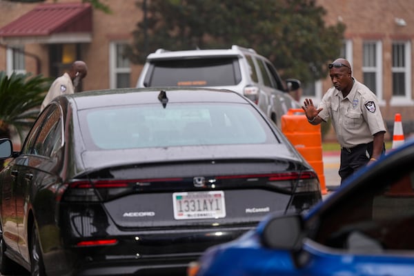 Police inspect vehicles for identification as they enter Tuskegee University, Monday, Nov. 11, 2024, in Tuskegee, Ala. (AP Photo/Mike Stewart)