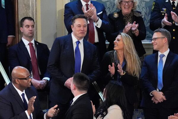 Elon Musk stands and is recognized and applauded as President Donald Trump addresses a joint session of Congress at the Capitol in Washington, Tuesday, March 4, 2025. (AP Photo/J. Scott Applewhite)