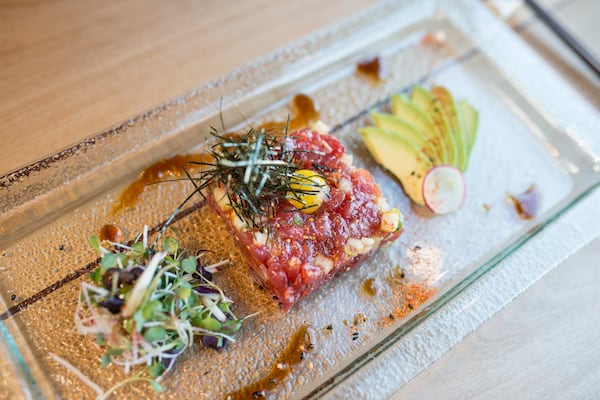  Hopstix Tuna Tartare starter with asian pear, avocado, pine nuts, and quail egg. Photo credit- Mia Yakel.