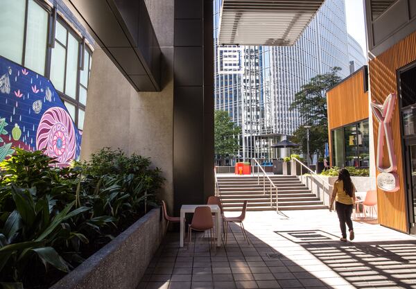 Midtown's Colony Square at the corner of Peachtree Street and 14th Street opens newly renovated space to the public that is open air with green space and additional loft office space. This corridor leads to the valet loop and features new art, a collaboration of four female artists.  The first public event in the new space is a dueling piano performance at the venue's weekly Groovin' on The Square at 6 pm on Friday, Oct 9, 2020.  (Jenni Girtman for the Atlanta Journal-Constitution)