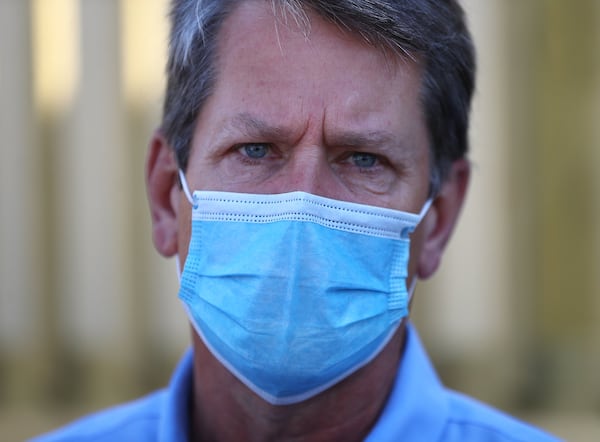 Gov. Brian Kemp wears a mask and urged all Georgians to do the same after touring the temporary medical pod that has been placed at the North Campus of Phoebe Putney Health System on Tuesday, May 5, 2020, in Albany. The pod at Phoebe North is scheduled to begin operations on Wednesday, May 6, housing 24 beds to treat non-critical COVID-19 patients. (CURTIS COMPTON / ccompton@ajc.com)