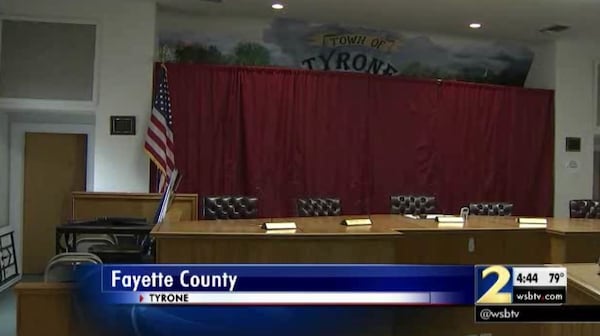 A curtain covers a mural that depicts a soldier with a Confederate flag. (Credit: Channel 2 Action News)