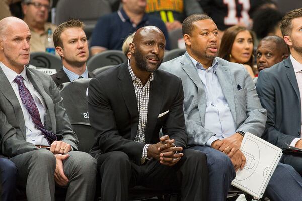 Hawks head coach Lloyd Pierce (middle) reacts from the bench. (Alyssa Pointer/Atlanta Journal Constitution)