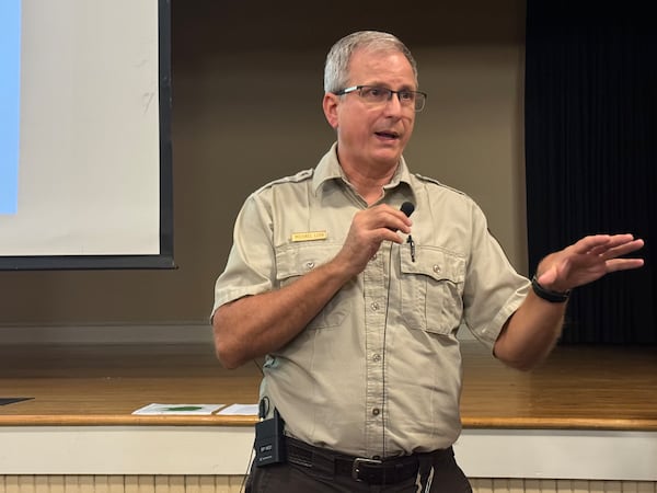 Michael Lusk, manager of the Okefenokee National Wildlife Refuge, speaks to a crowd gathered at a public meeting about the U.S. Fish and Wildlife Service's plan to expand the refuge's "acquisition boundary on Nov. 12, 2024, in Folkston, Ga. (Drew Kann/AJC)