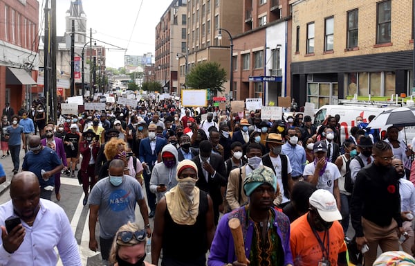 Rally participants marched down Auburn Avenue early Thursday afternoon. (Photo: Ryon Horne/AJC)