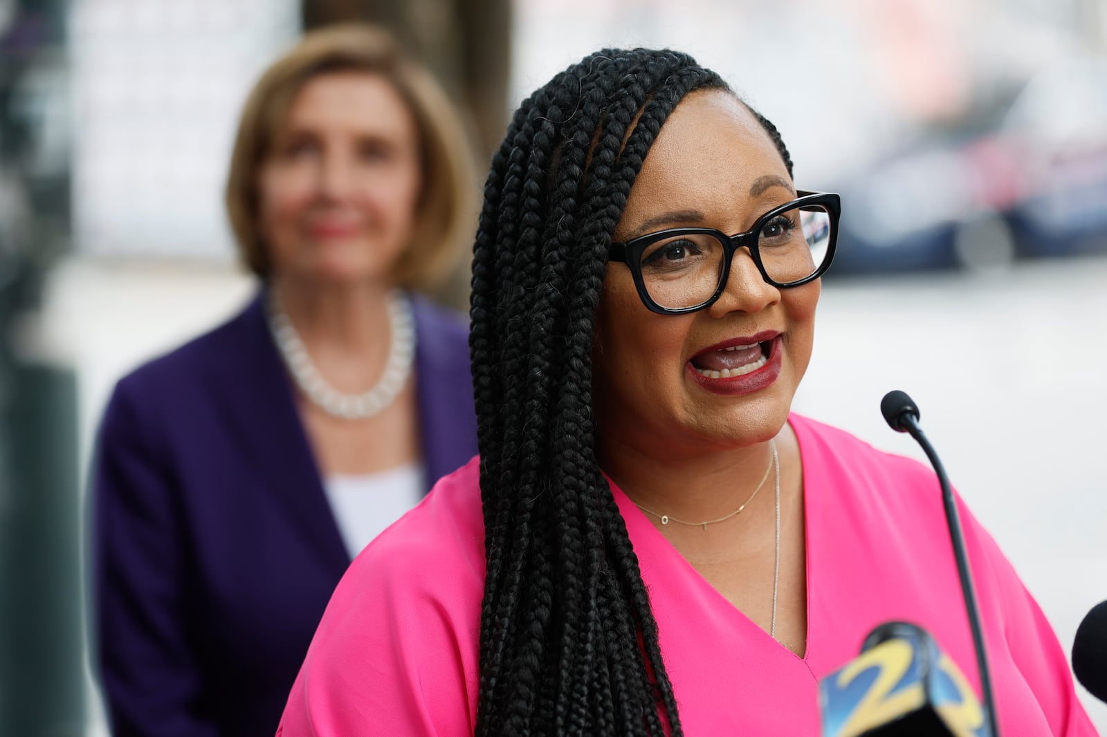 U.S. Rep. Nikema Williams, D-Ga., speaks to members of the media next to House Speaker Nancy Pelosi as they tour the Sweet Auburn District at Big Bethel AME Church on Thursday, Sept. 1, 2022, in Atlanta. (Jason Getz/AJC)