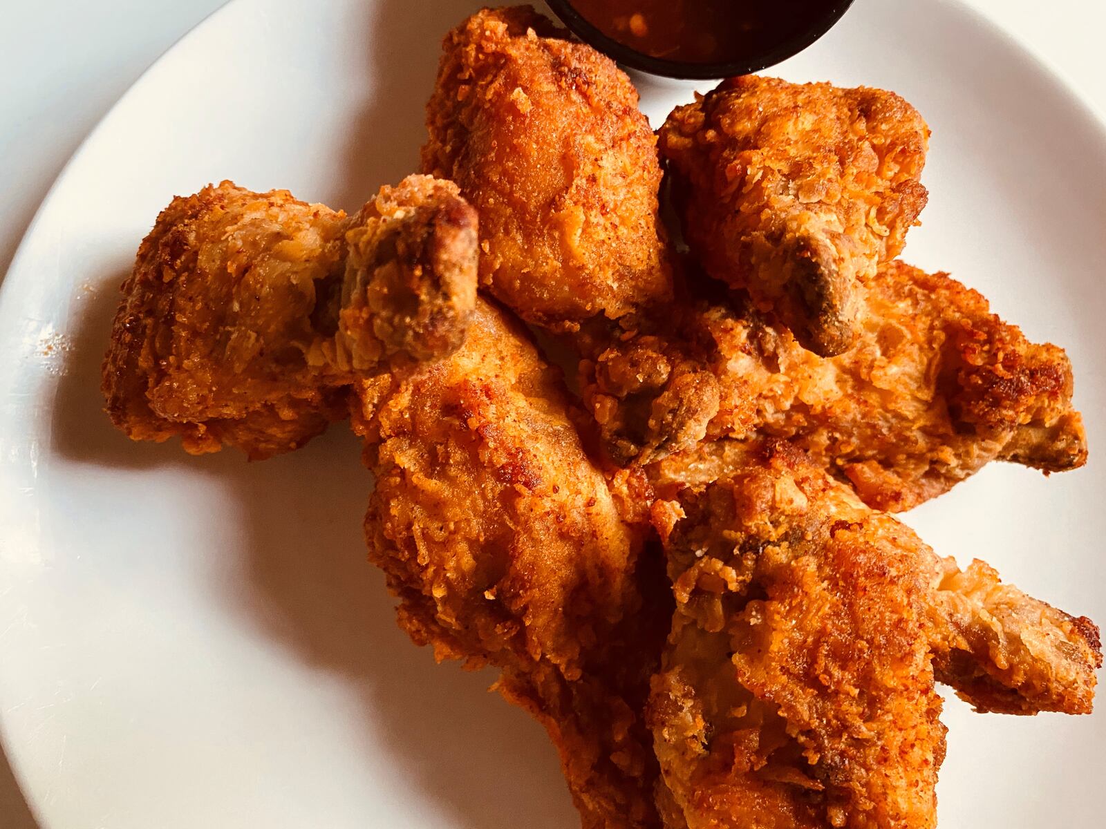 Bold Monk Brewing Co. offers duck confit fried chicken wings, with cayenne and chile honey. Bob Townsend for The Atlanta Journal-Constitution