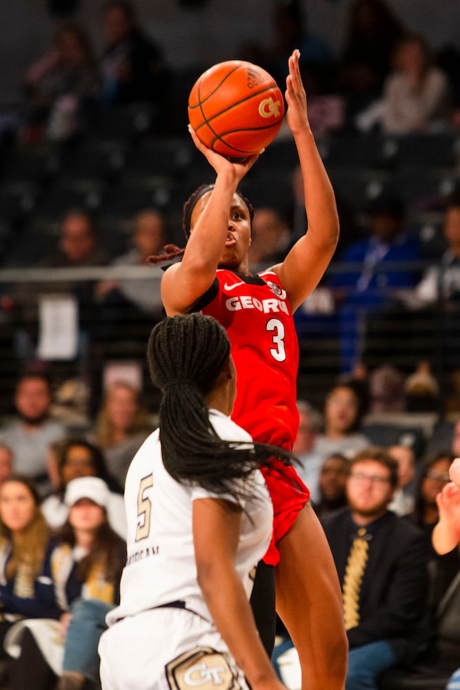 UGA's Diamond Battles shoots a 3-pointer against Georgia Tech on Sunday in Atlanta. (CHRISTINA MATACOTTA / FOR THE ATLANTA JOURNAL-CONSTITUTION)