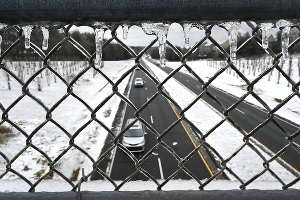 Cars travel on Ronald Reagan Parkway on, Saturday, January 11, 2025, in Gwinnett County. Slick roads and black ice could remain a problem Sunday morning. (Hyosub Shin / AJC)