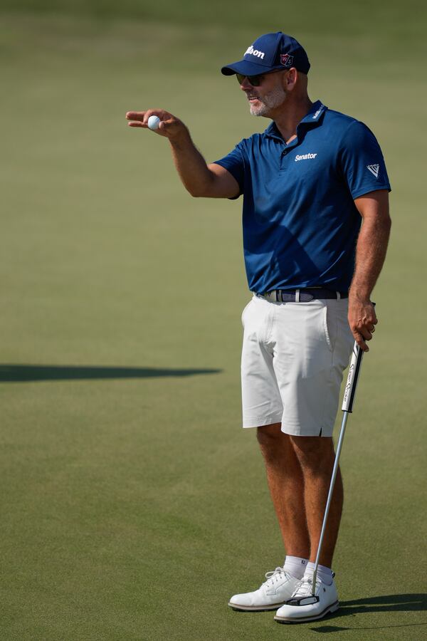 Paul Waring of England prepares to take a shot on 7th green in the final round of Abu Dhabi Golf Championship in Abu Dhabi, United Arab Emirates, Sunday, Nov. 10, 2024. (AP Photo/Altaf Qadri)