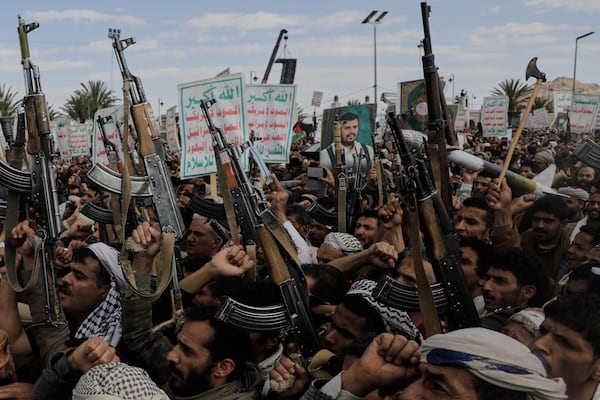 Houthi supporters chant slogans and hold pictures of Abdul Malik al-Houthi, the leader of the Houthi movement, during an anti-U.S. and anti-Israel rally in Sanaa, Yemen, Monday, March 17, 2025. (AP Photo/Osamah Abdulrahman)