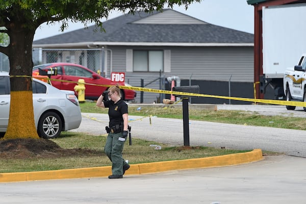 Personnel work at the site of the Lavish nightclub.