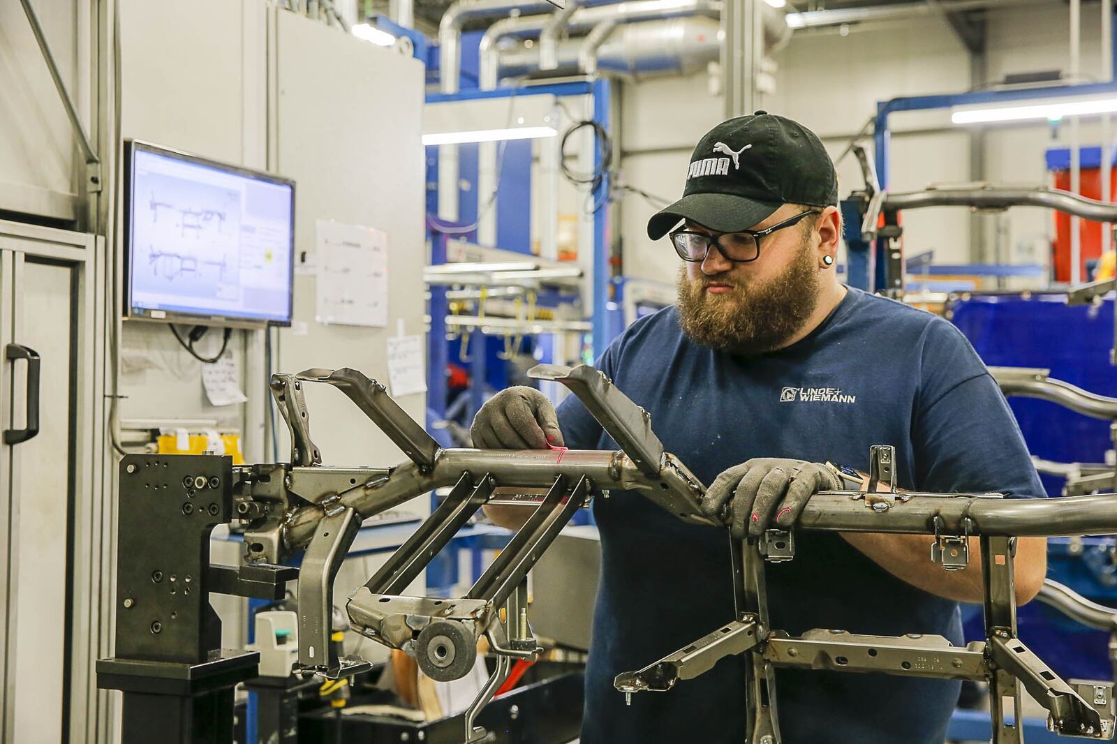 Jonathan Pitts prepares a product at the Linde Wiemann factory and distribution center in Lavonia. (ALYSSA POINTER/ALYSSA.POINTER@AJC.COM)