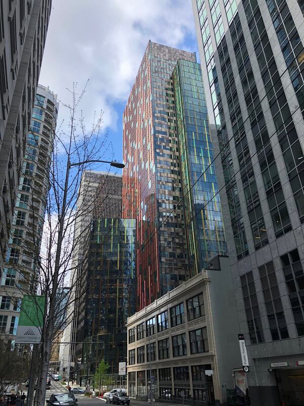 Amazon’s Doppler tower, center, shimmers in the sunlight of downtown Seattle in April 2018. The company’s campus, stretching across more than three dozen buildings, has helped transform downtown Seattle. (SCOTT TRUBEY / Scott.Trubey@ajc.com