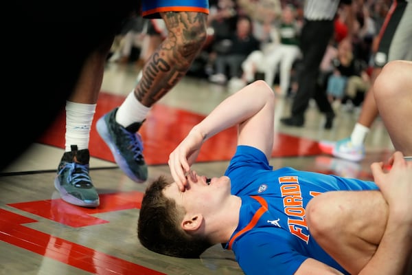 Florida forward Alex Condon (21) reacts after a foul during an NCAA college basketball game against Georgia, Tuesday, Feb. 25, 2025, in Athens, Ga. (AP Photo/Brynn Anderson)