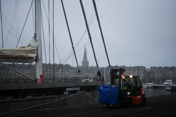 A fenwick brings a pallet to be loaded on the sailboat 'Grain de Sail II' at the port of Saint Malo, western France, Nov. 8, 2024. (AP Photo/Thibault Camus)