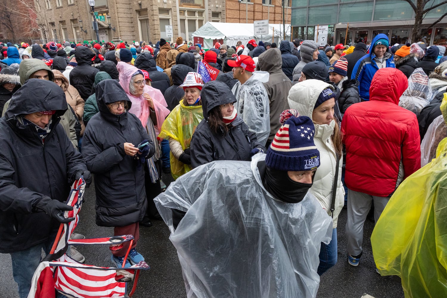 Trump supporters wait to enter a Trump rally at Capital One Arena in Washington, D.C. on Sunday, January 19, 2025, one day before Donald Trump’s inauguration. (Arvin Temkar / AJC)