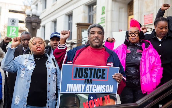 Jimmy Atchison's father protests with supporters outside the Fulton County Courthouse in Atlanta in late 2022. File photo. (CHRISTINA MATACOTTA FOR THE ATLANTA JOURNAL-CONSTITUTION)