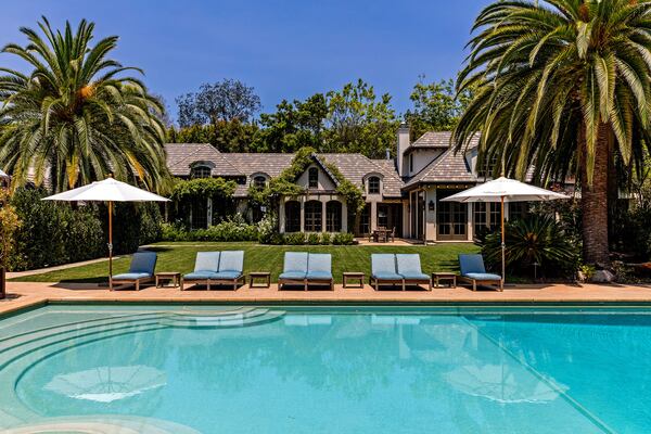 

Set on 1.25 acres in Beverly Hills, the manicured grounds hold a French country-inspired mansion, two guesthouses and a 60-foot swimming pool. (The Agency)