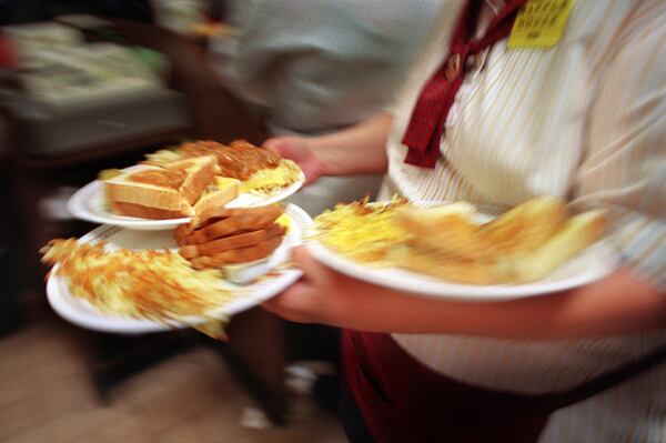 The prices may be higher, but the Waffle House menu still contains most of the original 16 items from the chain's founding a half-century ago.  (JOEY IVANSCO/AJC staff)