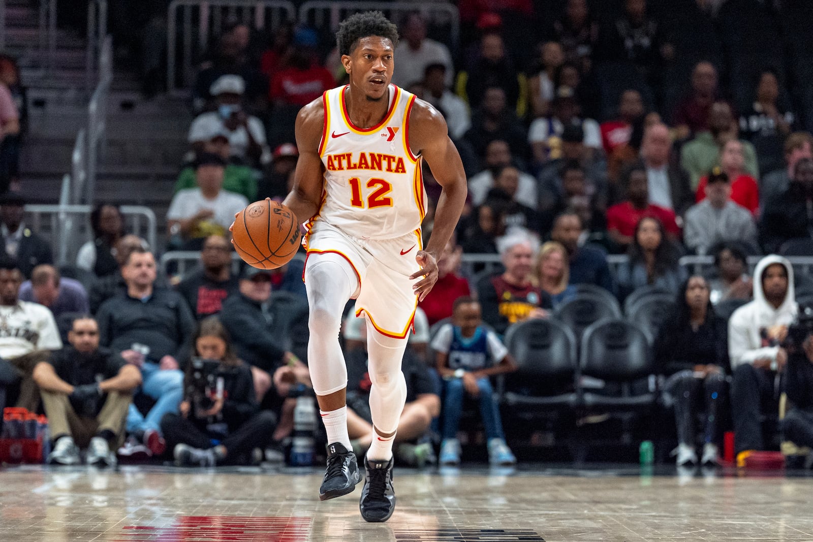 Atlanta Hawks forward De'Andre Hunter dribbles during the first half of an NBA basketball game against the Charlotte Hornets, Friday, Oct. 25, 2024, in Atlanta. (AP Photo/Jason Allen)